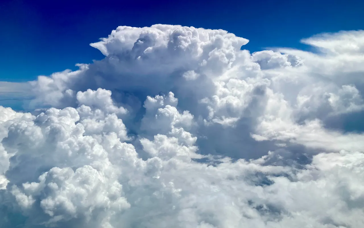 A towering cumulonimbus cloud over the Mediterranean seen from above