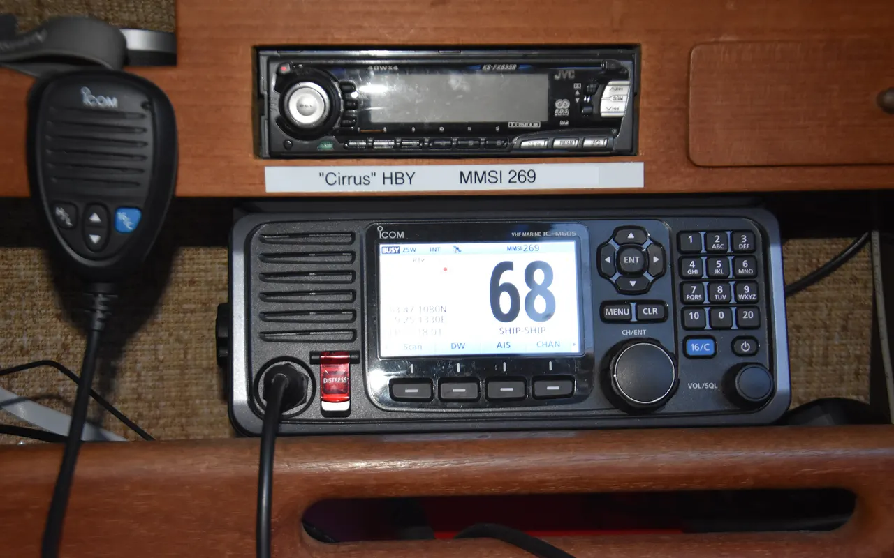 A fixed marine VHF DSC radio with a handset, showing channel 68