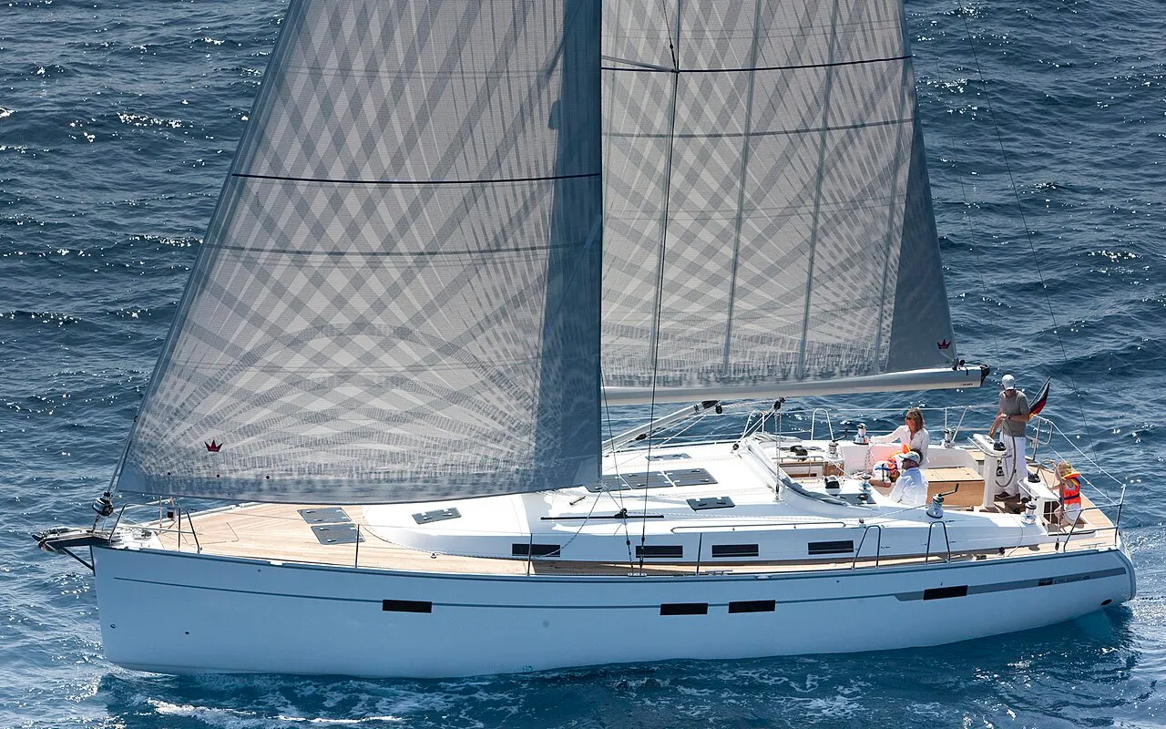 A 45-foot cruising sailboat under full sail, showing the mast, mainsail, headsail, boom and hull