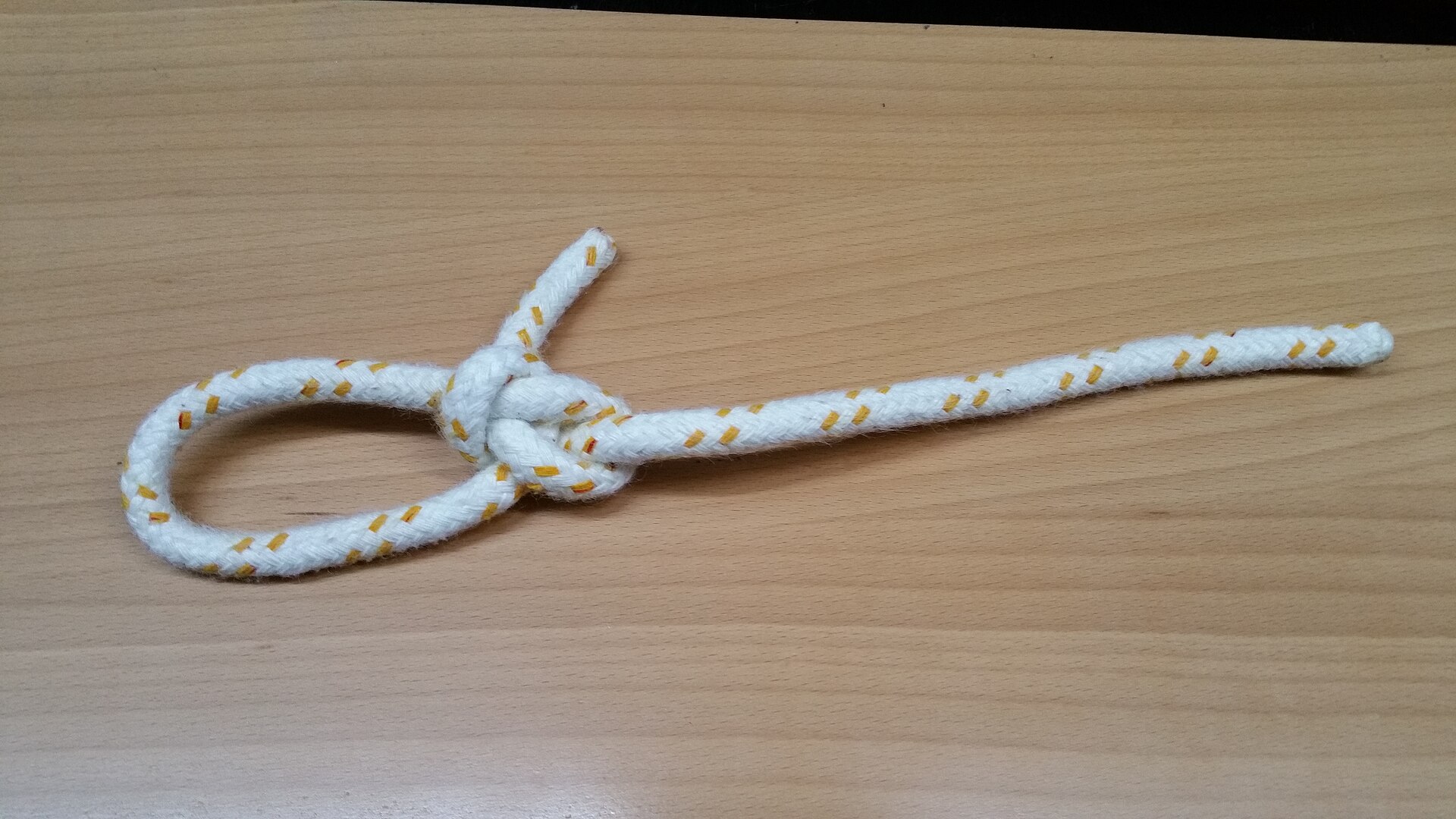The finished bowline with a fixed loop and the tail inside it