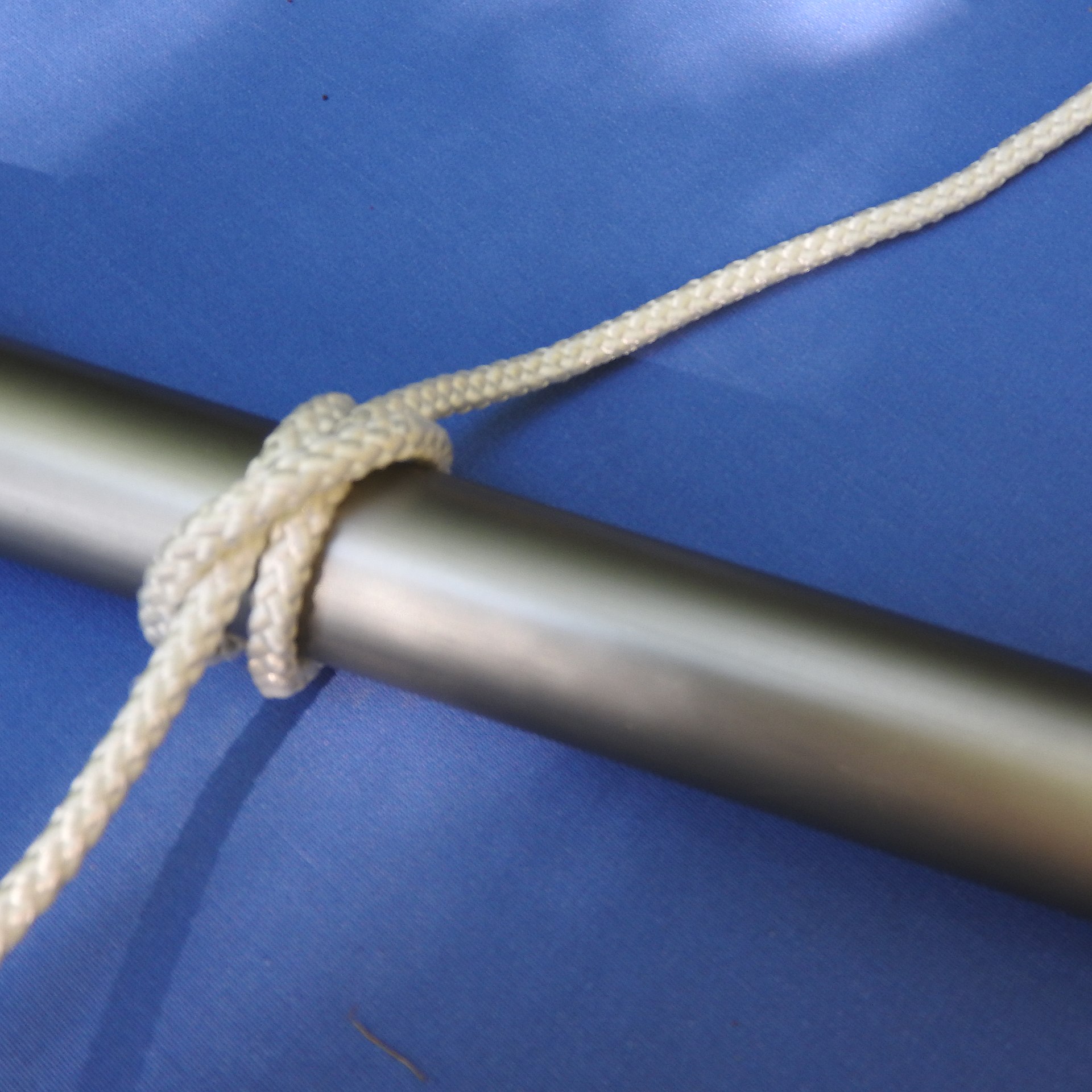 A finished clove hitch on a metal rail
