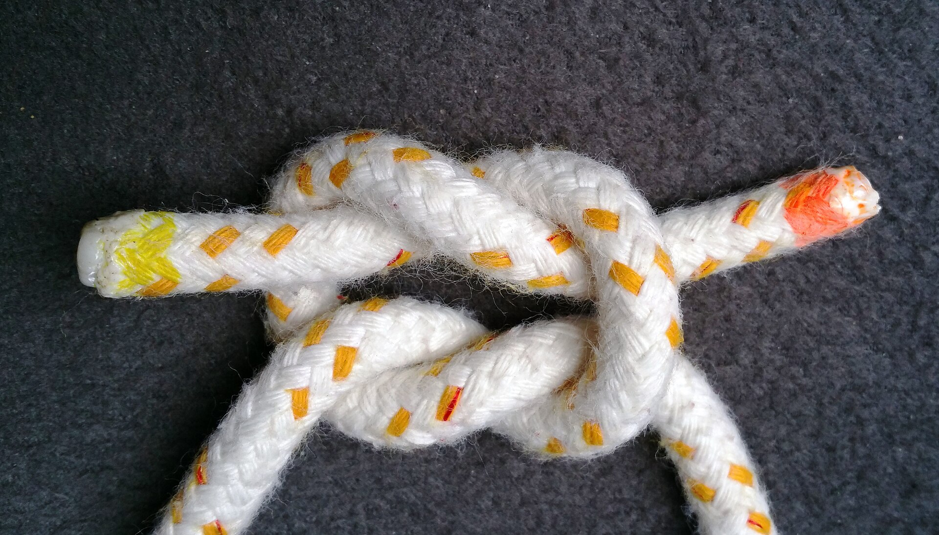 A finished reef knot, flat and symmetrical