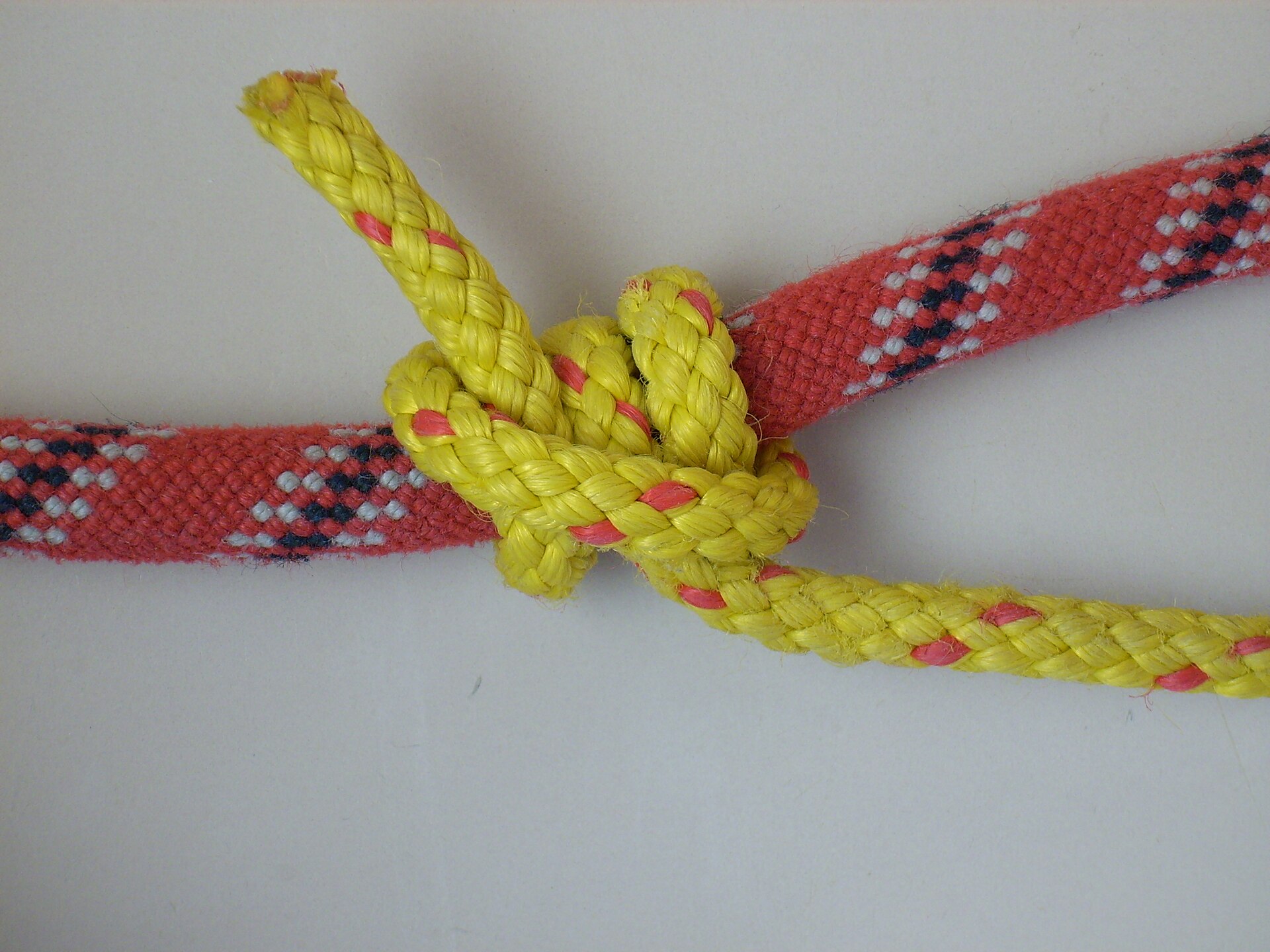 The finished rolling hitch on the red rope