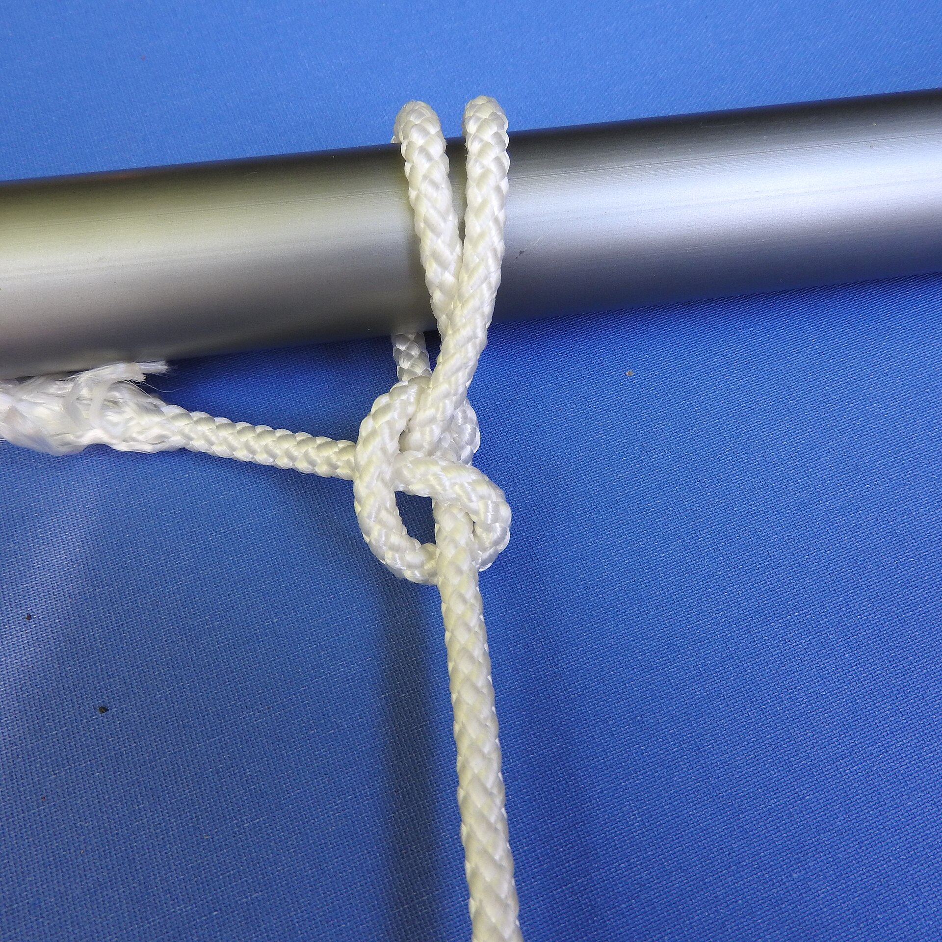 A round turn and two half hitches on a pole
