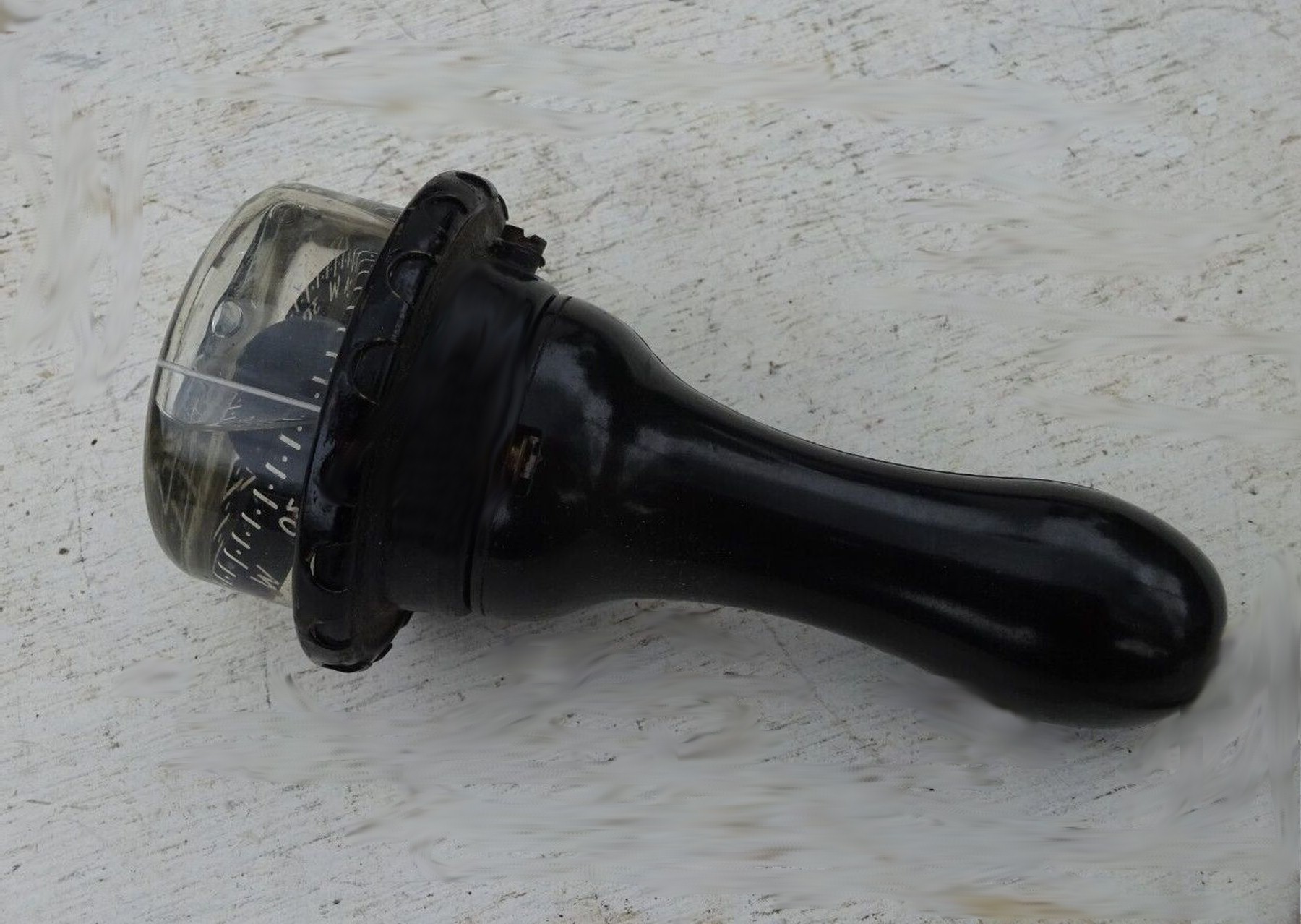 A hand-bearing compass of the type used to take visual fixes