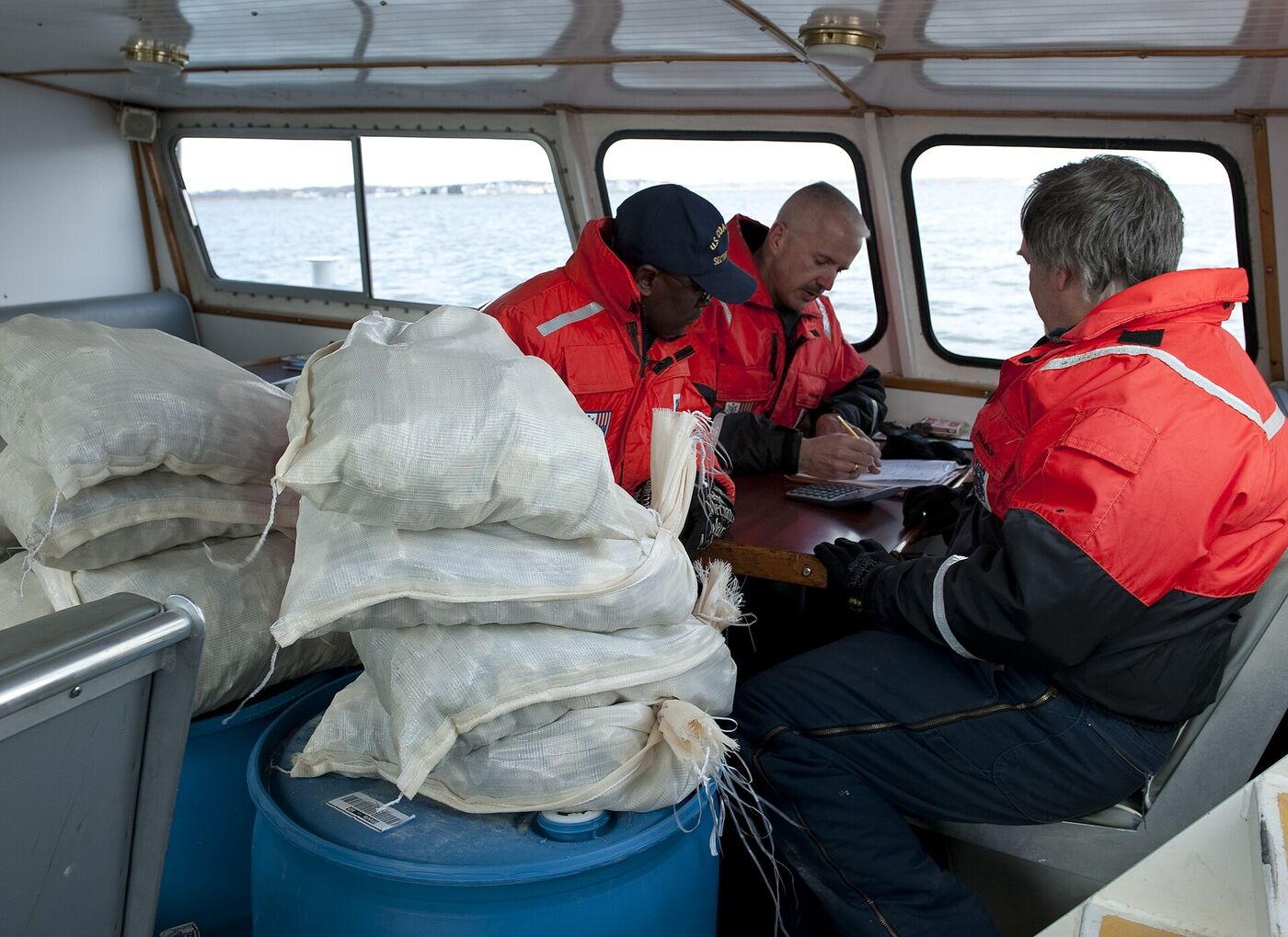 Coast Guard marine inspectors at work during a vessel stability test