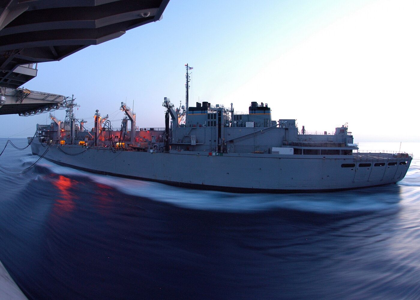 USNS Arctic refuelling a warship at sea, an underway replenishment