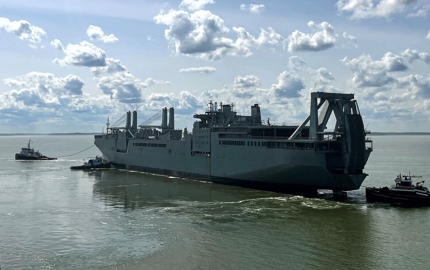 USNS Shughart, a large roll-on roll-off ship, under tow between US ports